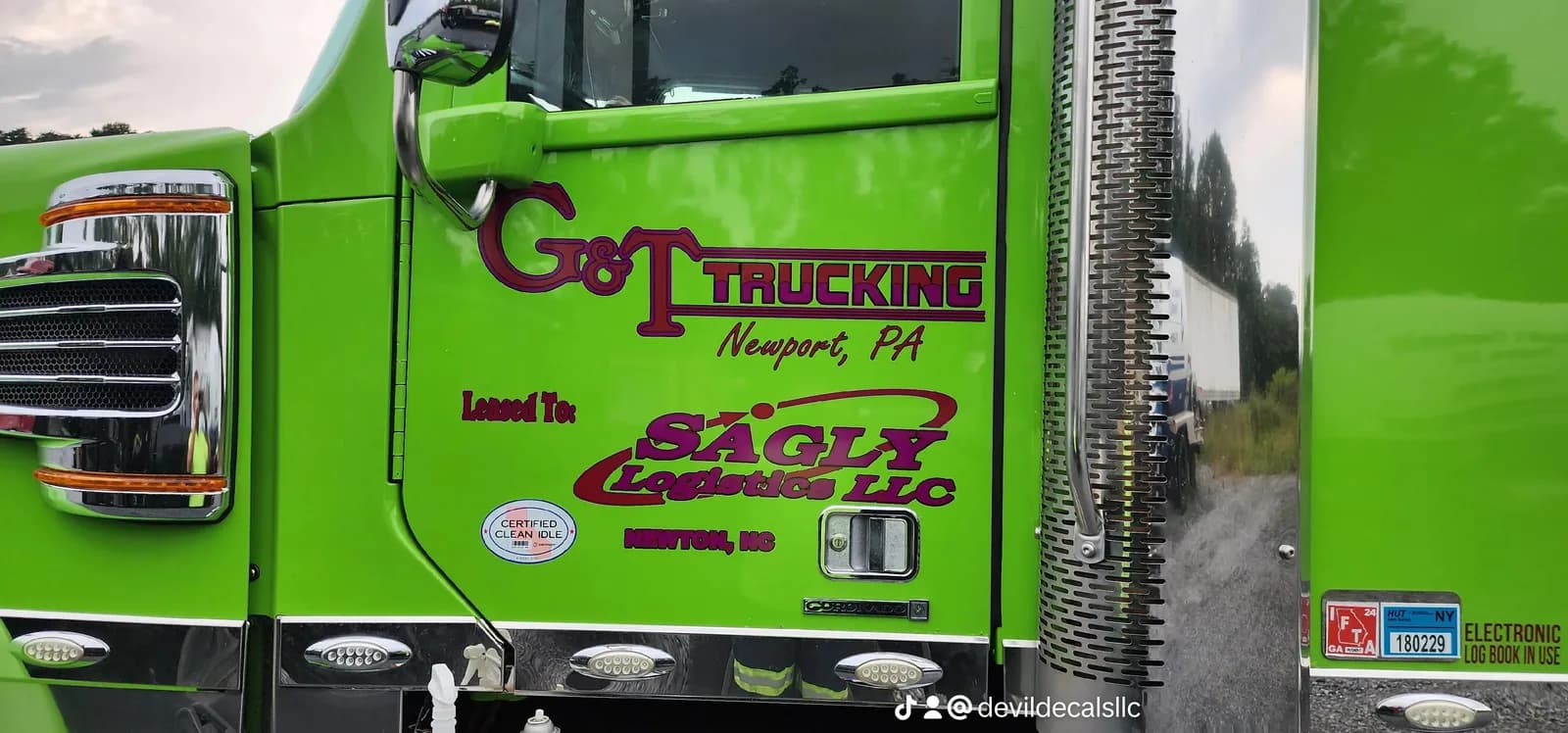 Bright green commercial truck with custom Devil Decals graphics