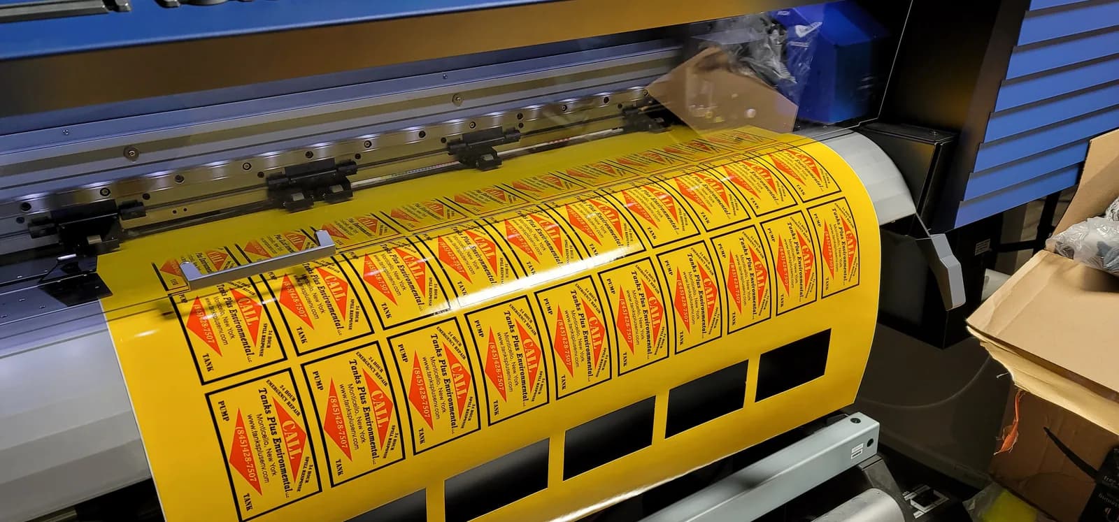 Printed decal run coming off a wide-format printer